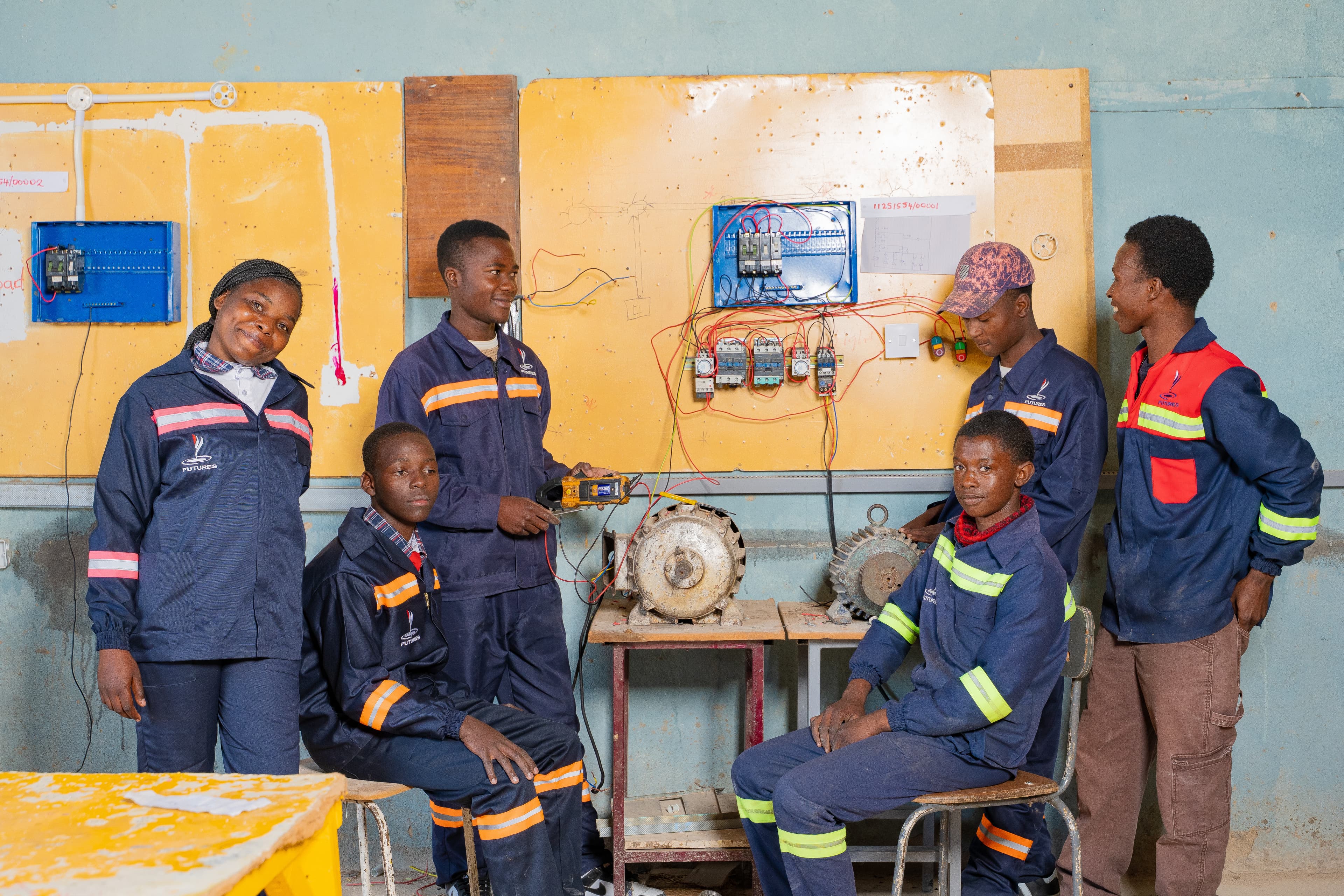 Students working on technical drawing