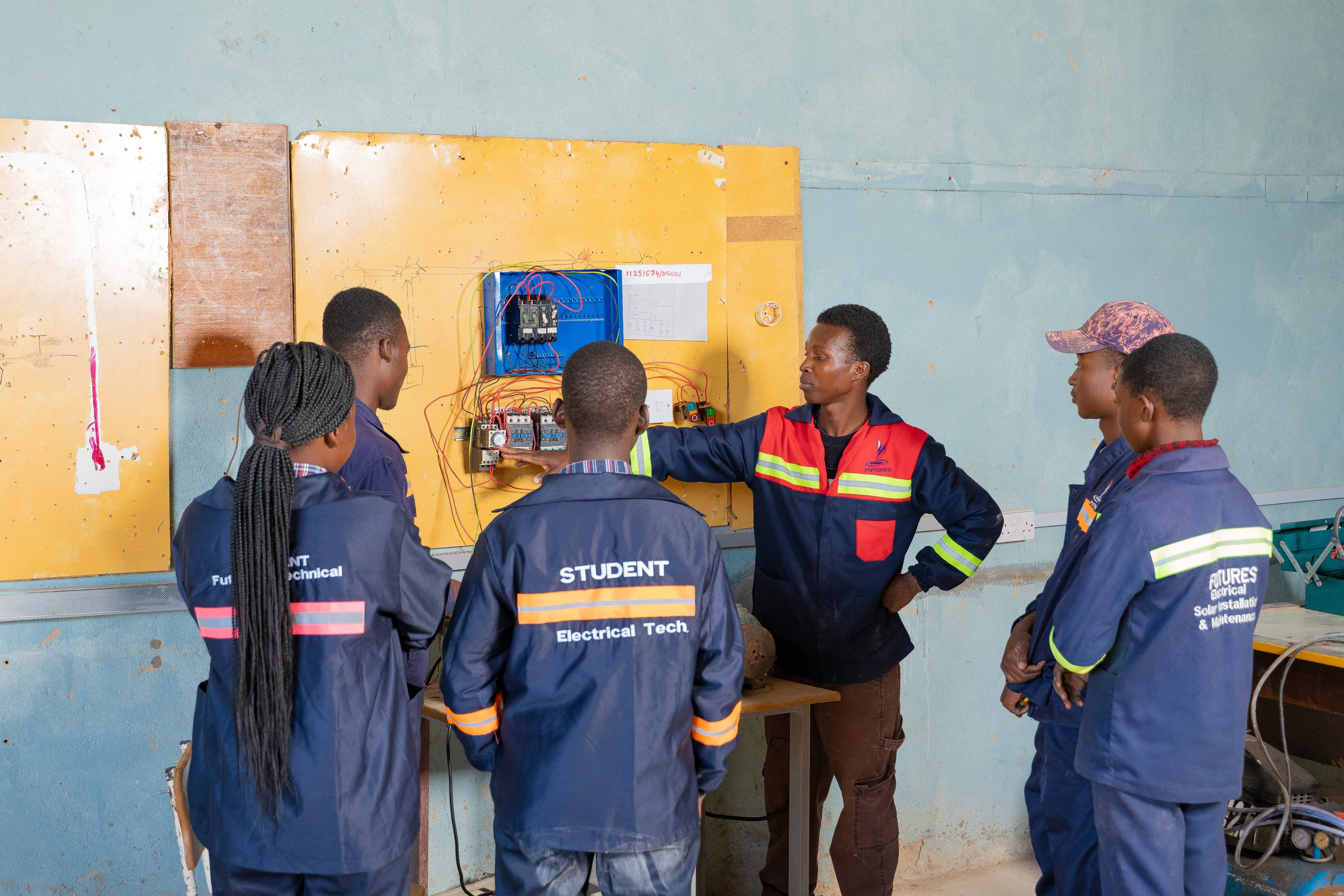 Students working on electrical wiring practical