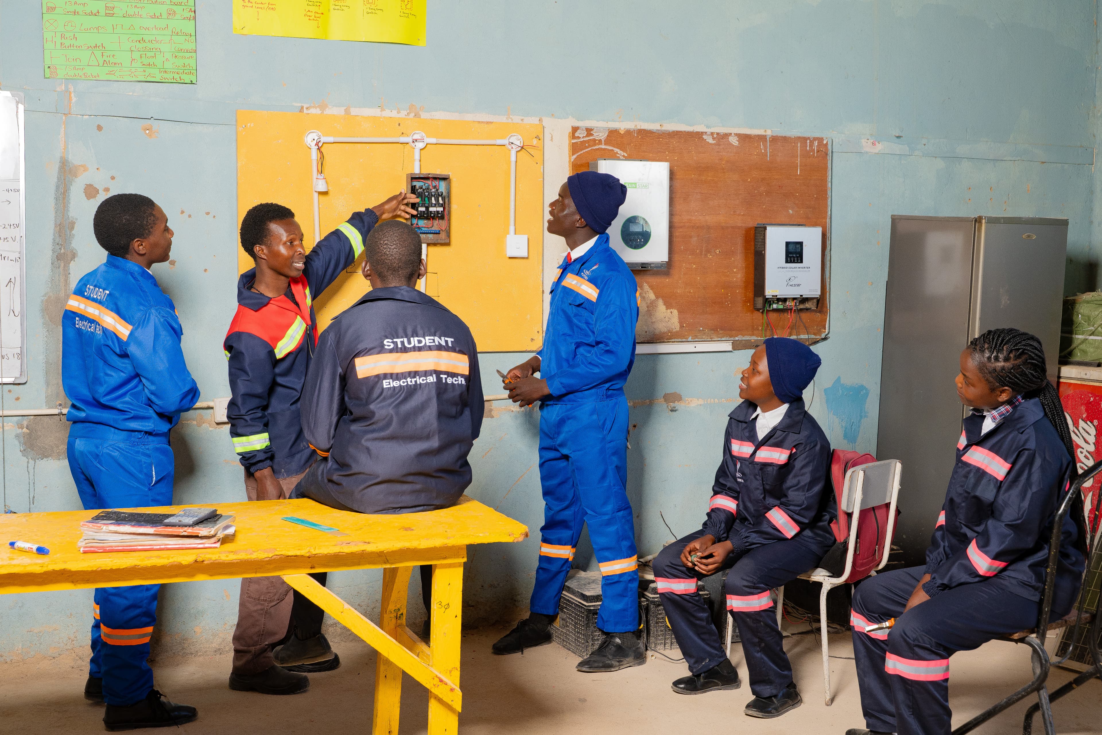 Students in motor mechanics practical class