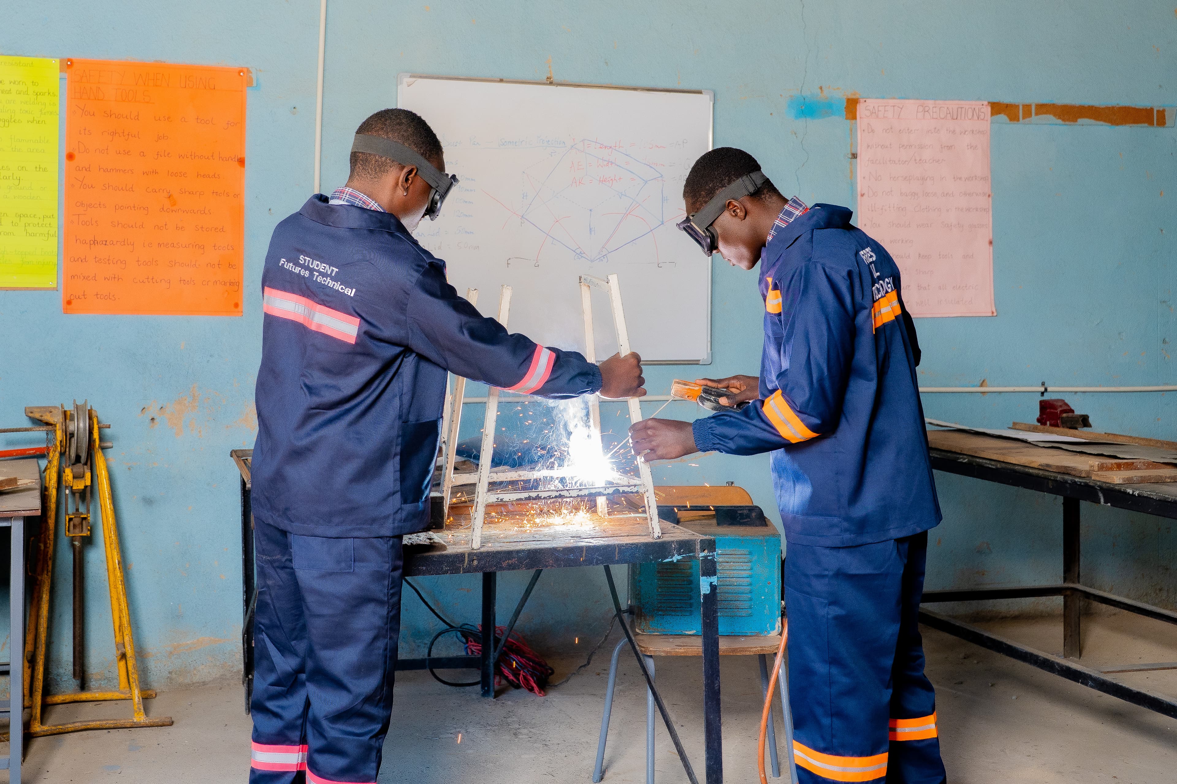 Students in motor mechanics practical class