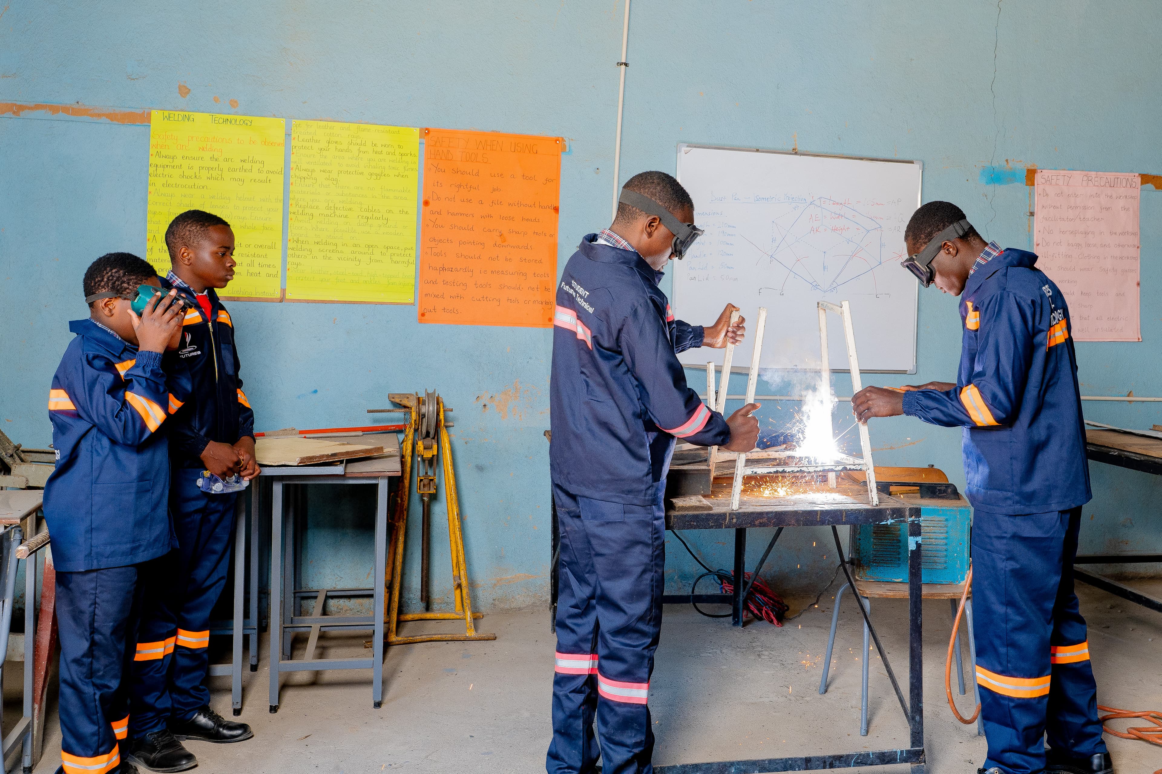 Students engaged in technical subject practicals