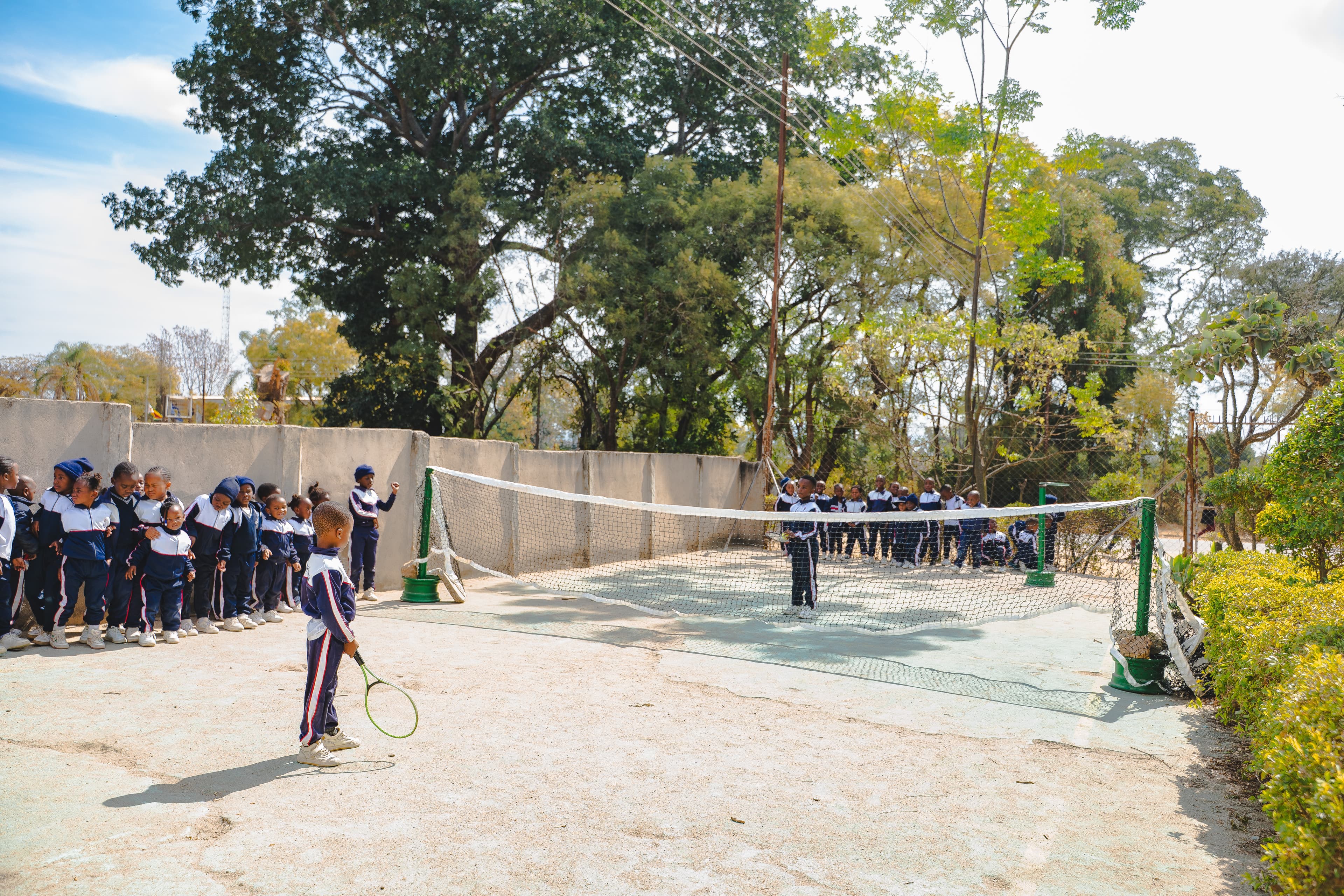 Students playing tennis