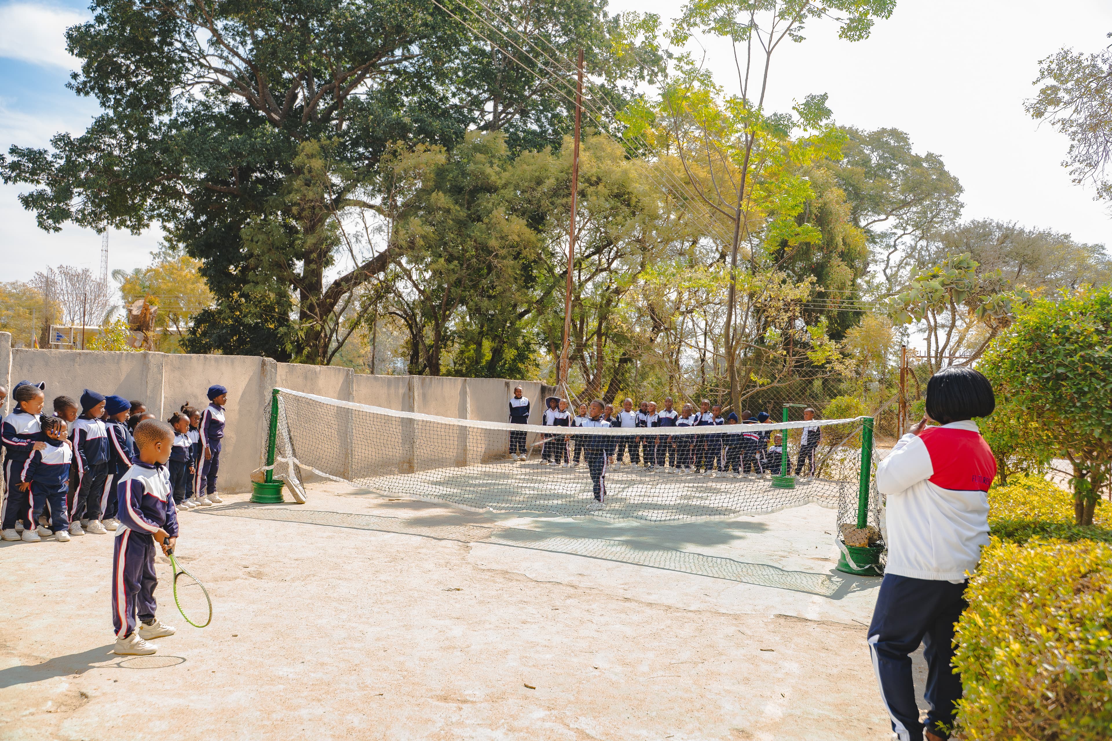 Students playing tennis