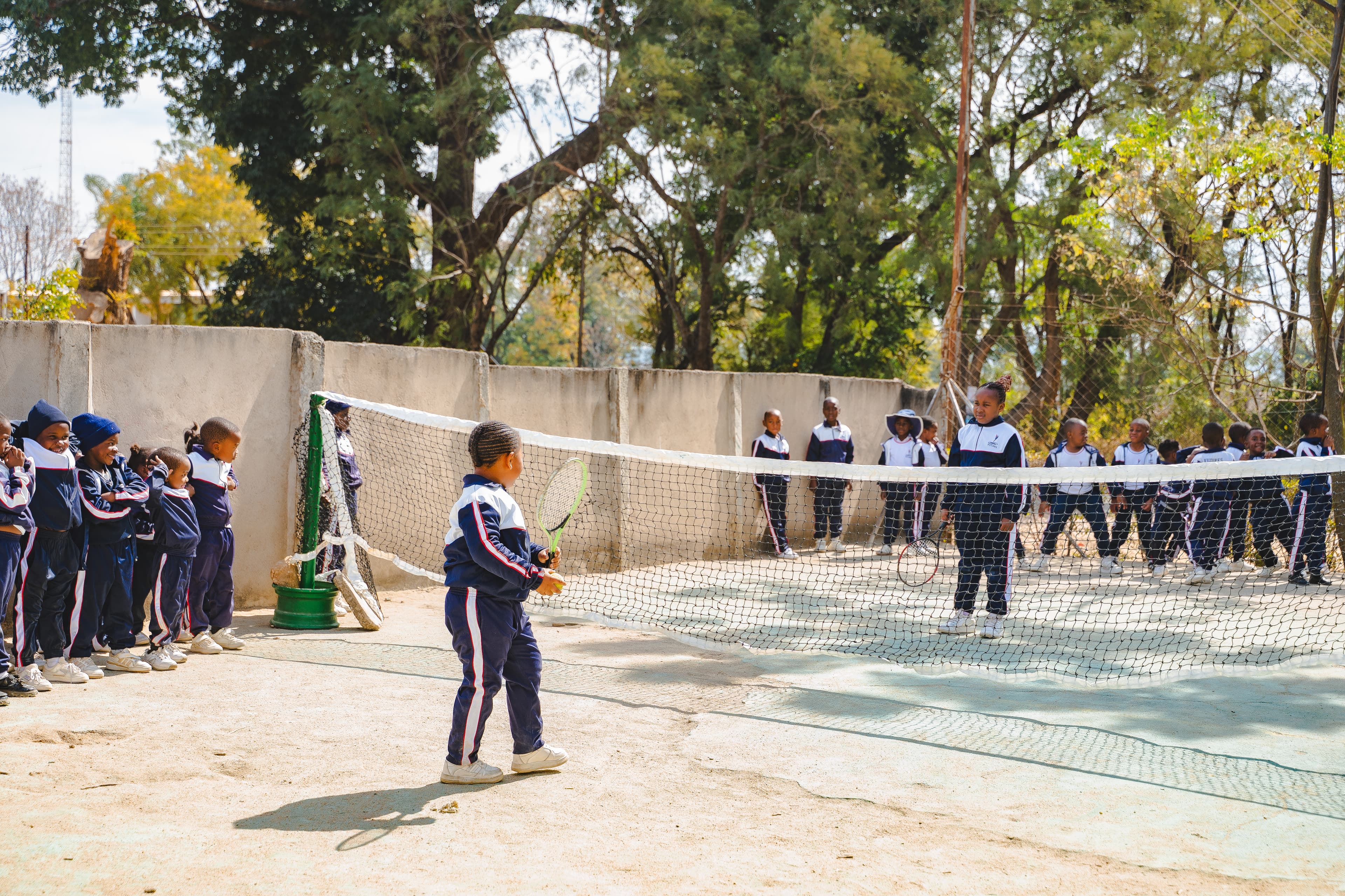Students playing tennis
