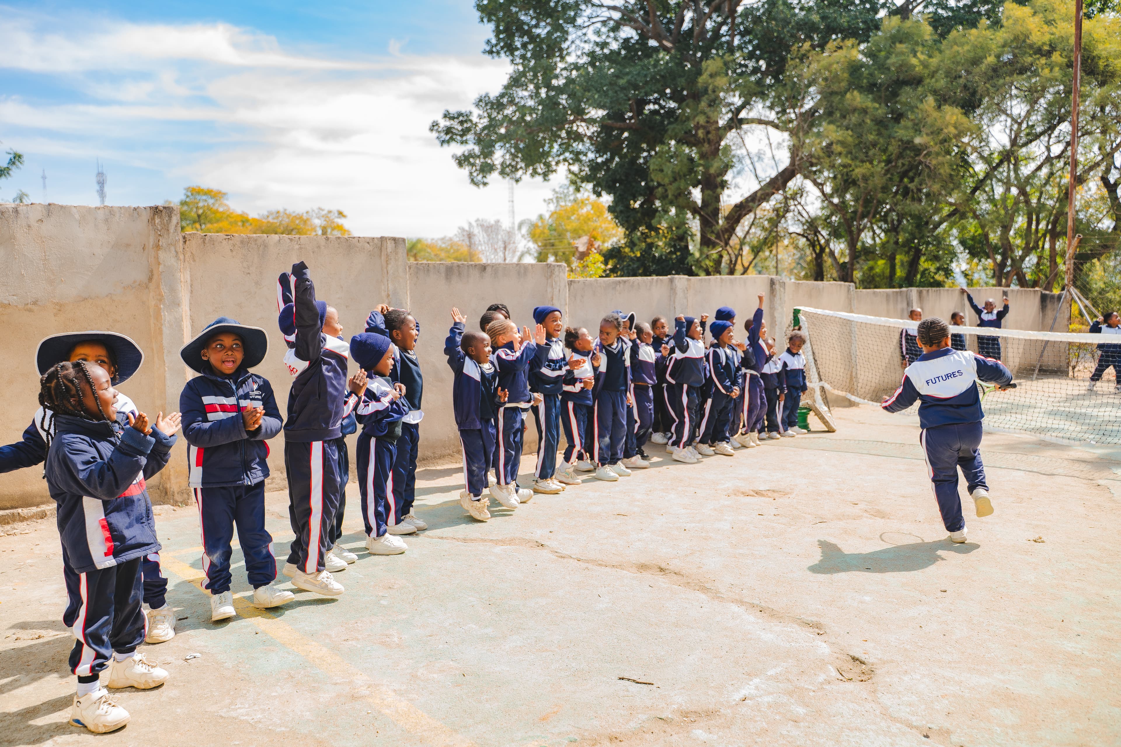 Students playing tennis